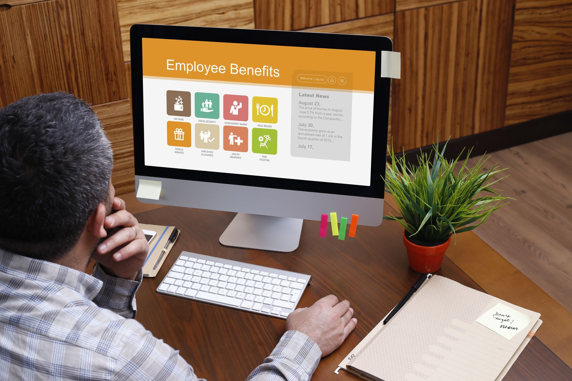 Man using computer with Employee Benefits concept on screen