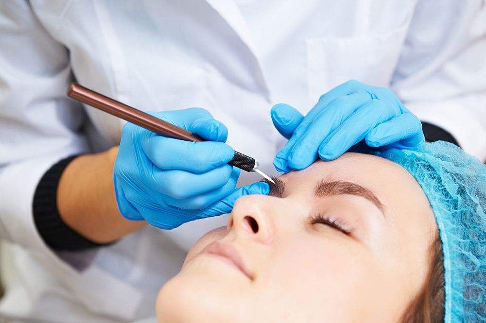 A Person Receiving an Eyebrow Microblading Treatment — Pink Lily Beauty in Blacksmiths, NSW