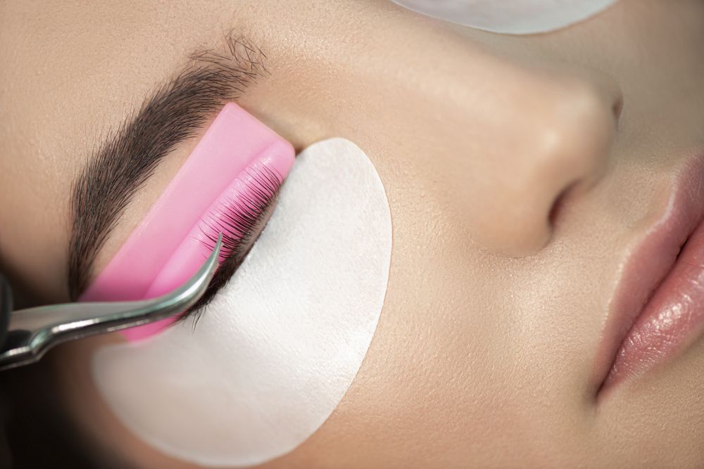 Close-Up of Eye During Eyelash Extension Procedure — Pink Lily Beauty in Blacksmiths, NSW