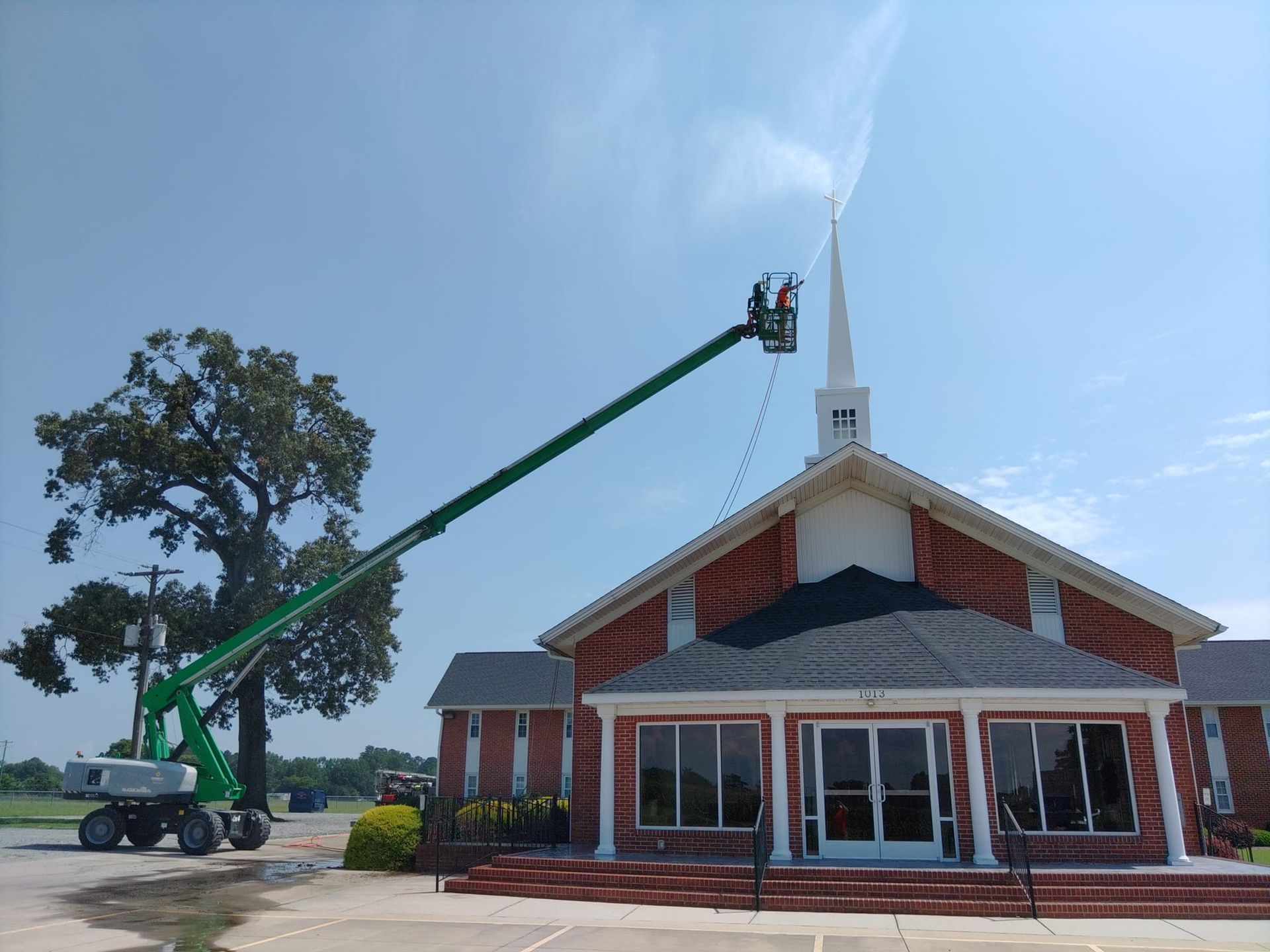 Pine State Pro Wash cleaning a church steple in Raleigh with commercial grade washing equipment.