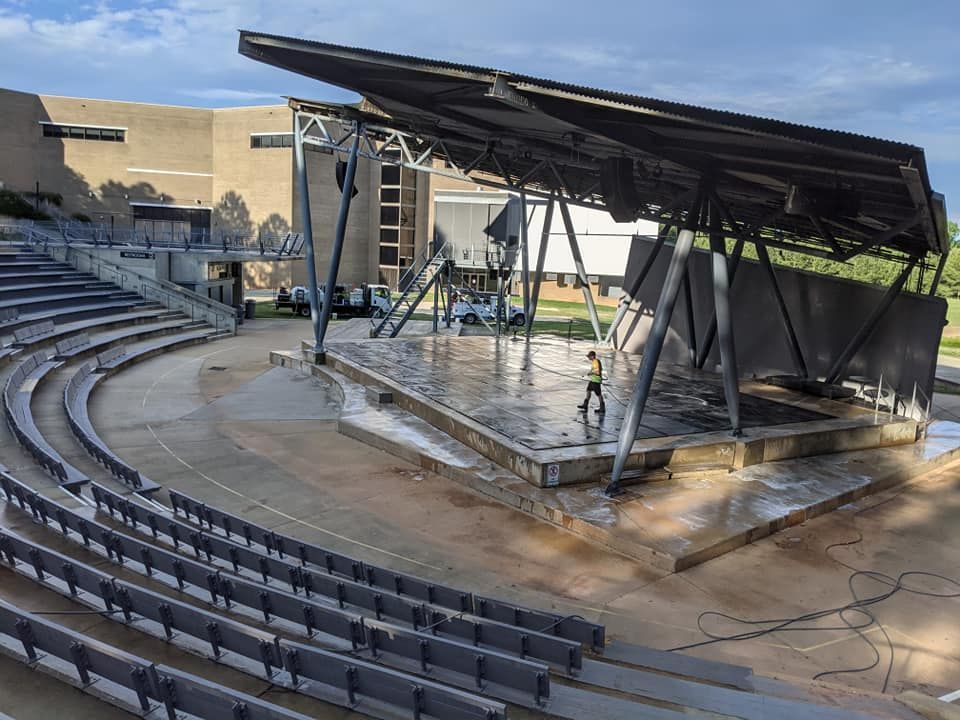 Pine State Pro Wash cleaning an ampitheater in Raleigh with commercial grade washing equipment.