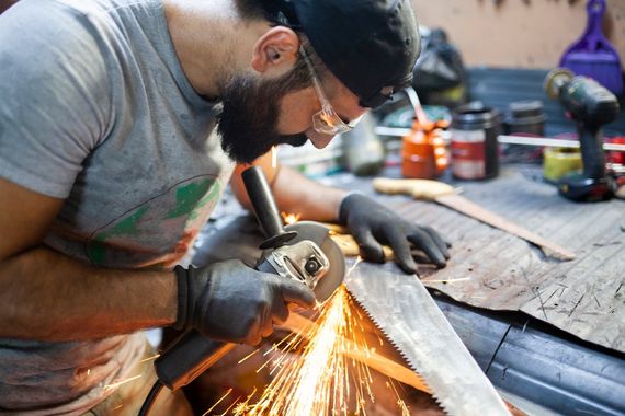 Using Grinder On A Saw — Newark, DE — J & A Grinding Inc.