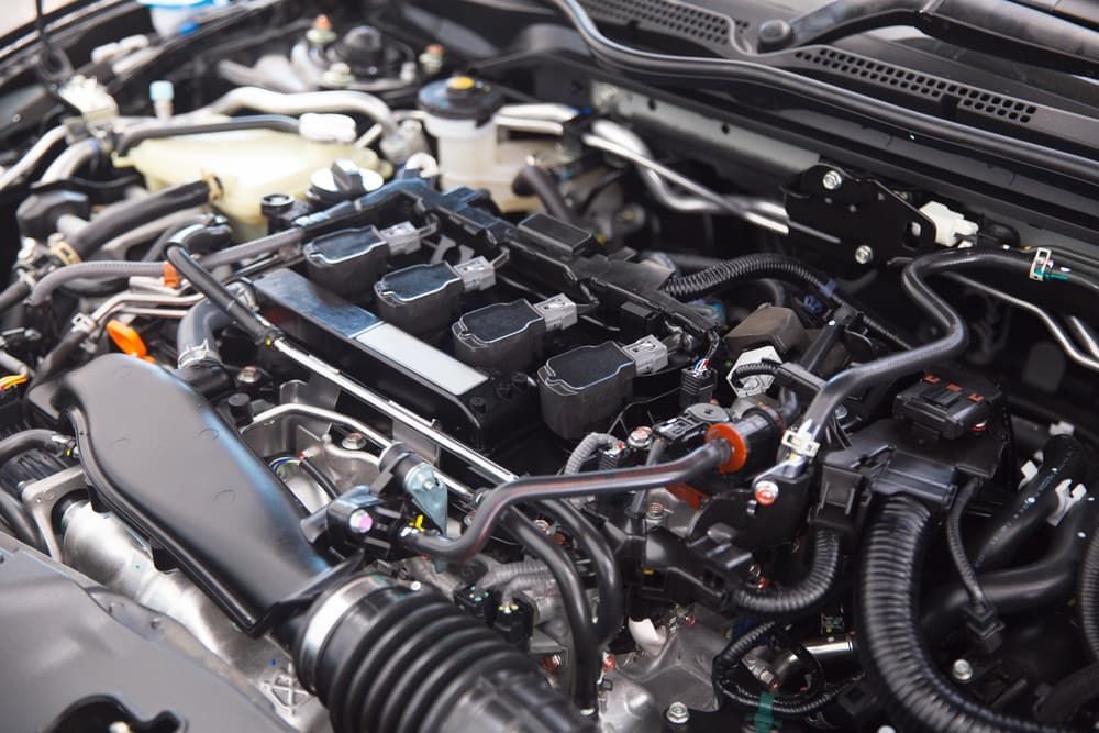 A Close Up of the Engine of a Car With the Hood Open — Coastal Automotive Services Long Jetty in Long Jetty, NSW