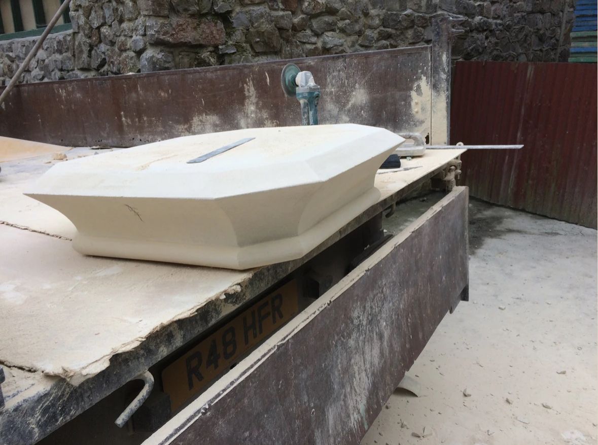 A large white object is sitting on top of a wooden table.