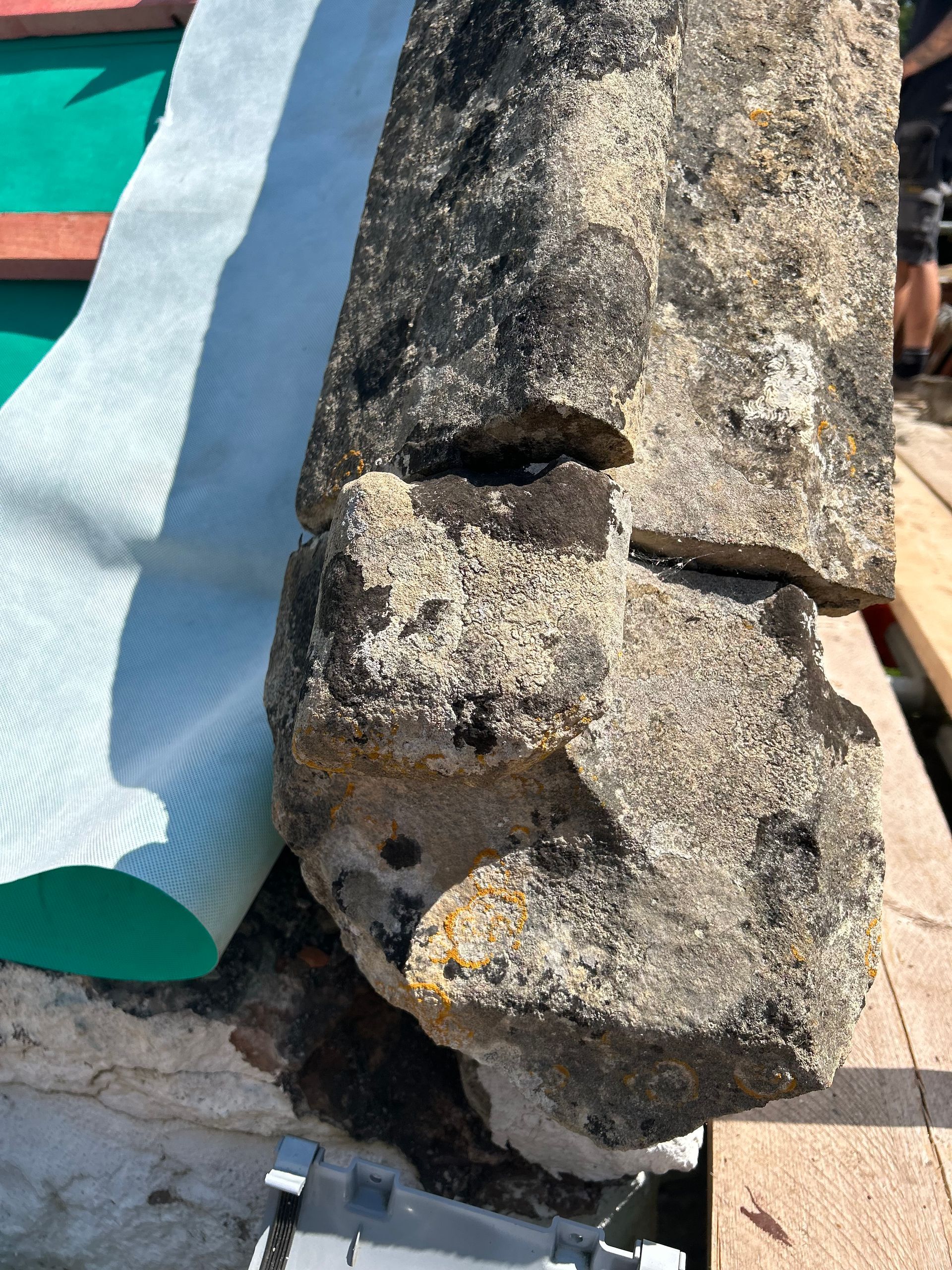 A large rock is sitting on top of a wooden table.