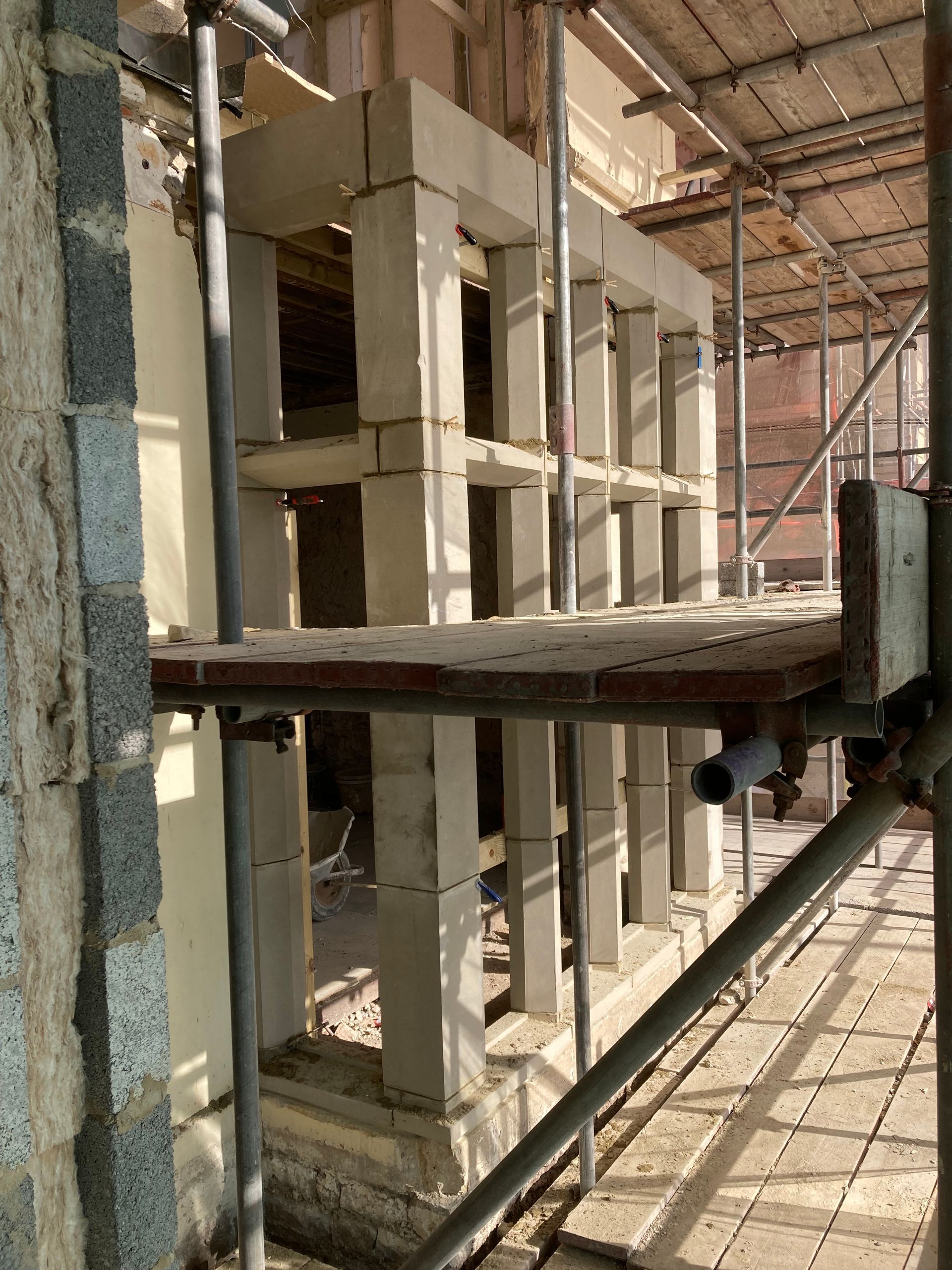 A building under construction with scaffolding around it