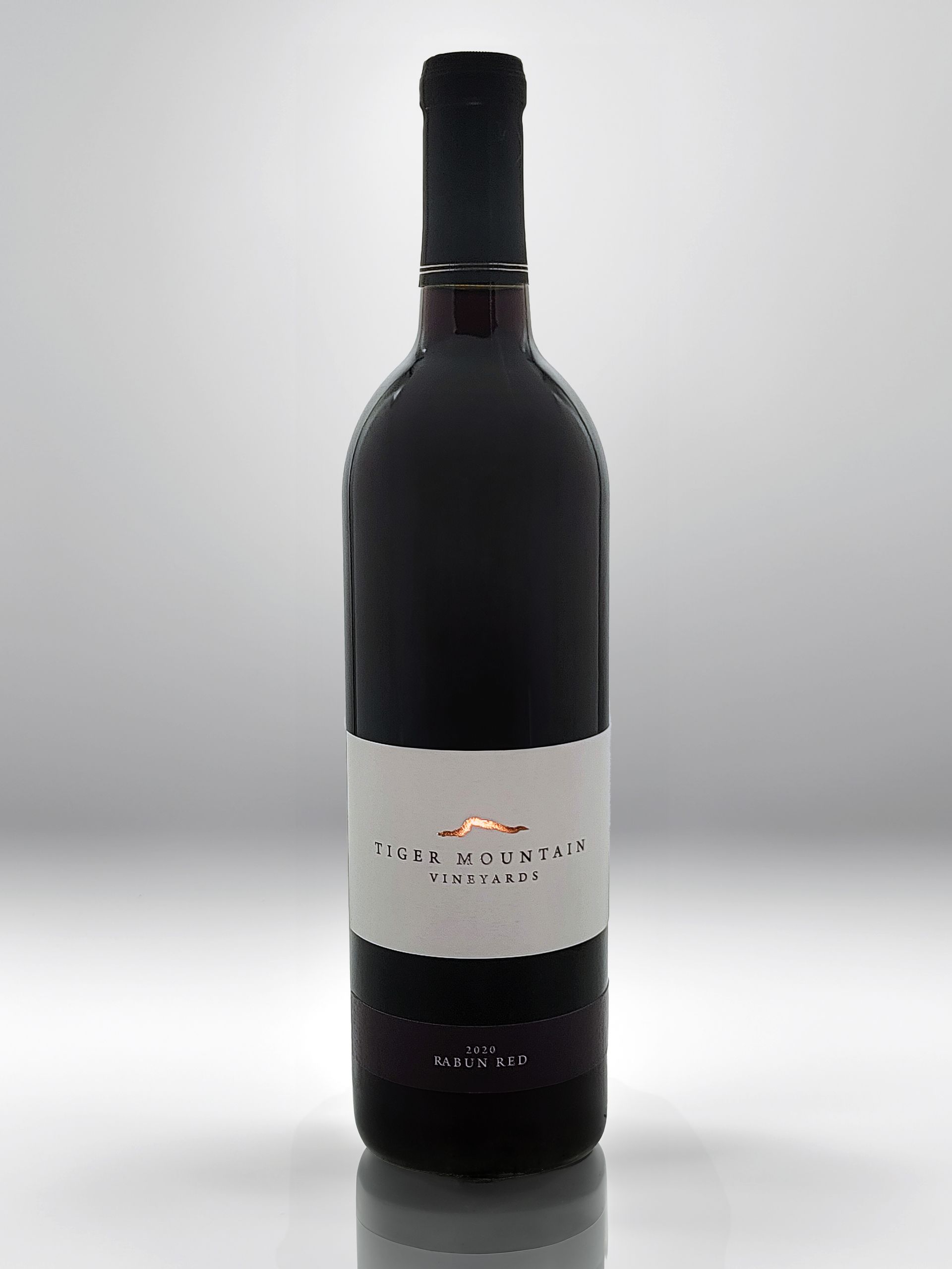 A bottle of red wine with a white label