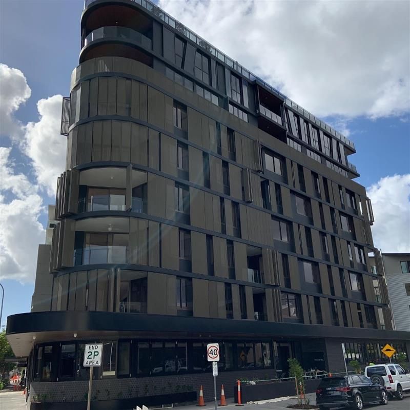 A large building with a sign that says no parking