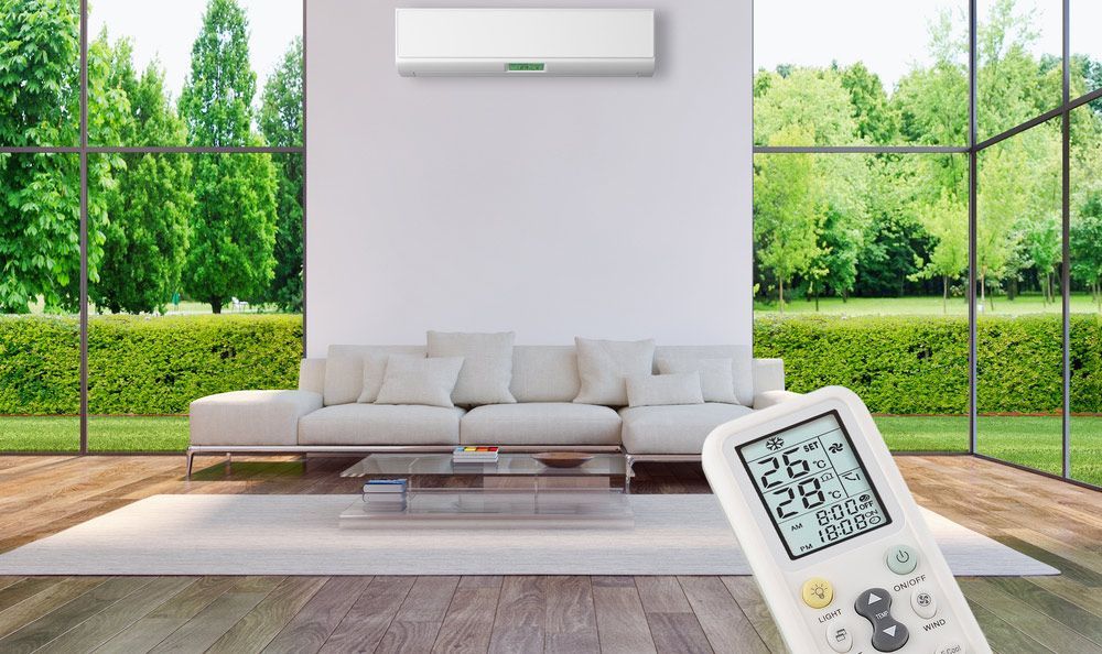 Operating the Remote in a Living Area with Air Conditioning — Air Conditioning Repairs in St Georges Basin NSW