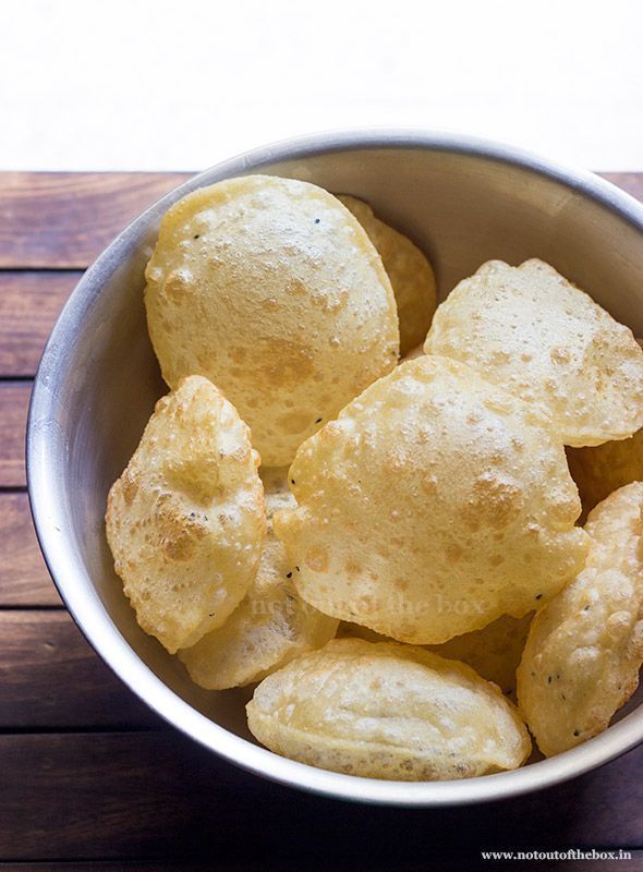 Bowl of puffed chips on a wooden table