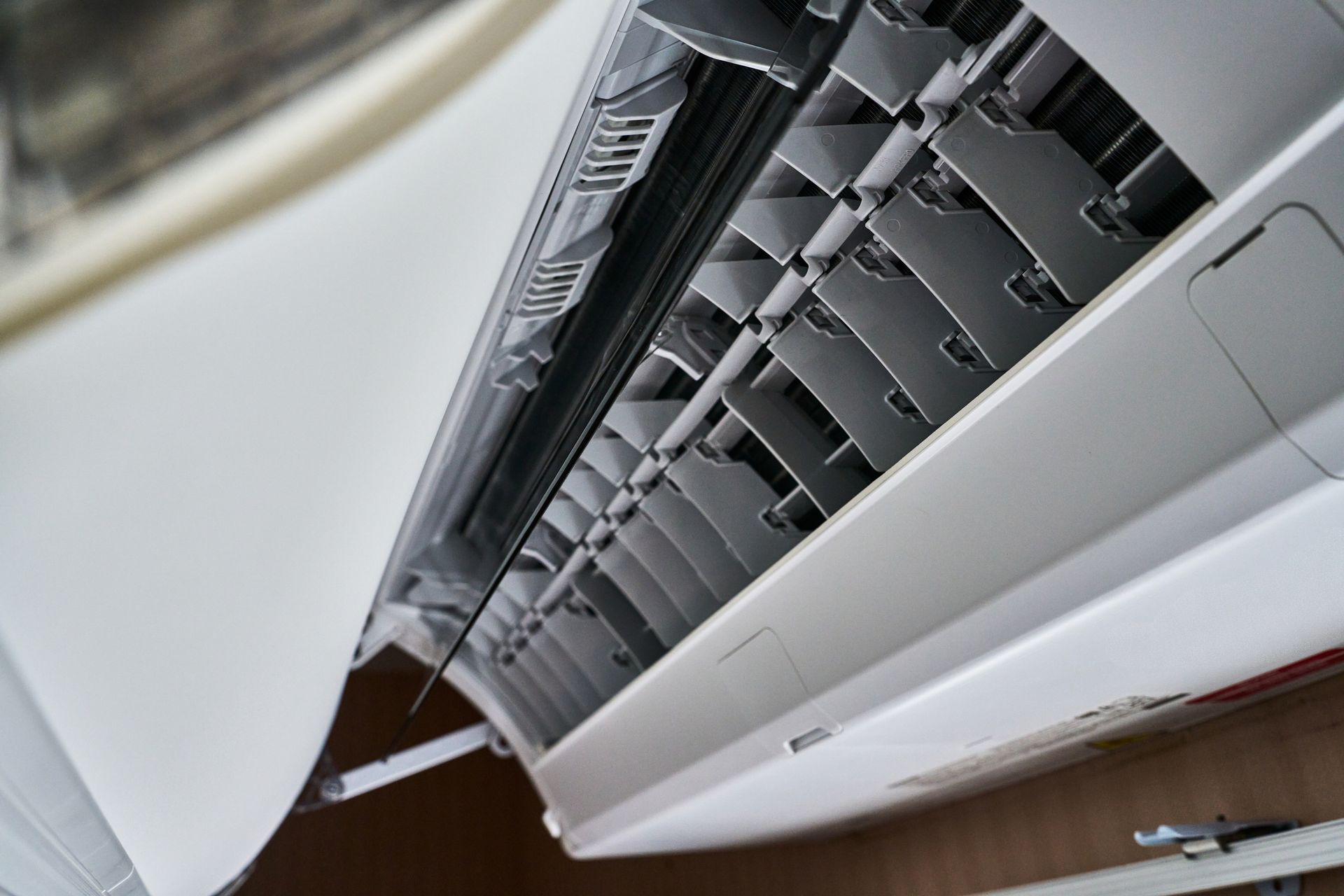 Open air conditioner unit showing internal components during maintenance work.