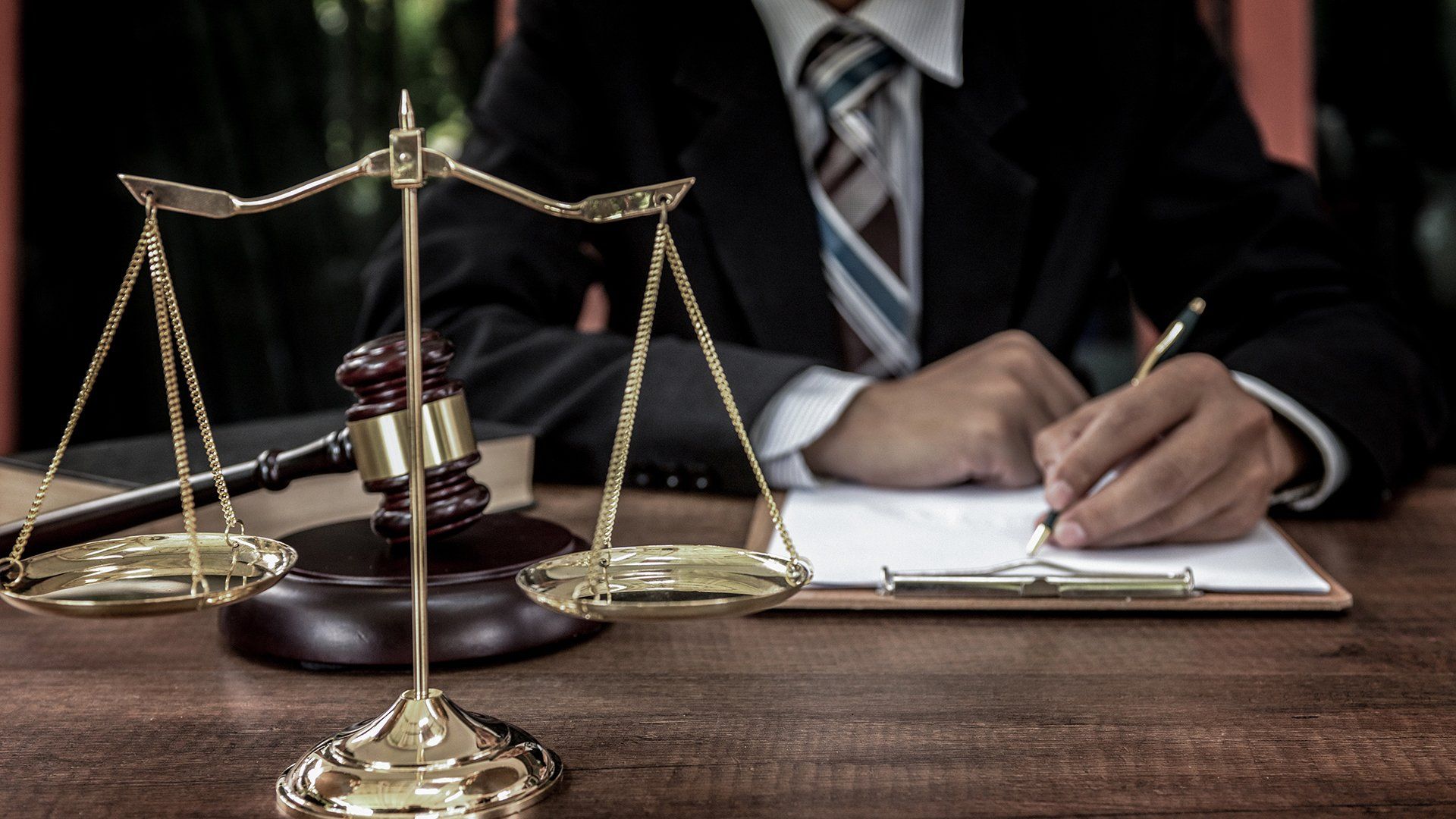 Signing Document On Table — Goshen, NY — John E. Bach Jr. Attorney at Law Signing Document On Table — Goshen, NY — John E. Bach Jr. Attorney at Law