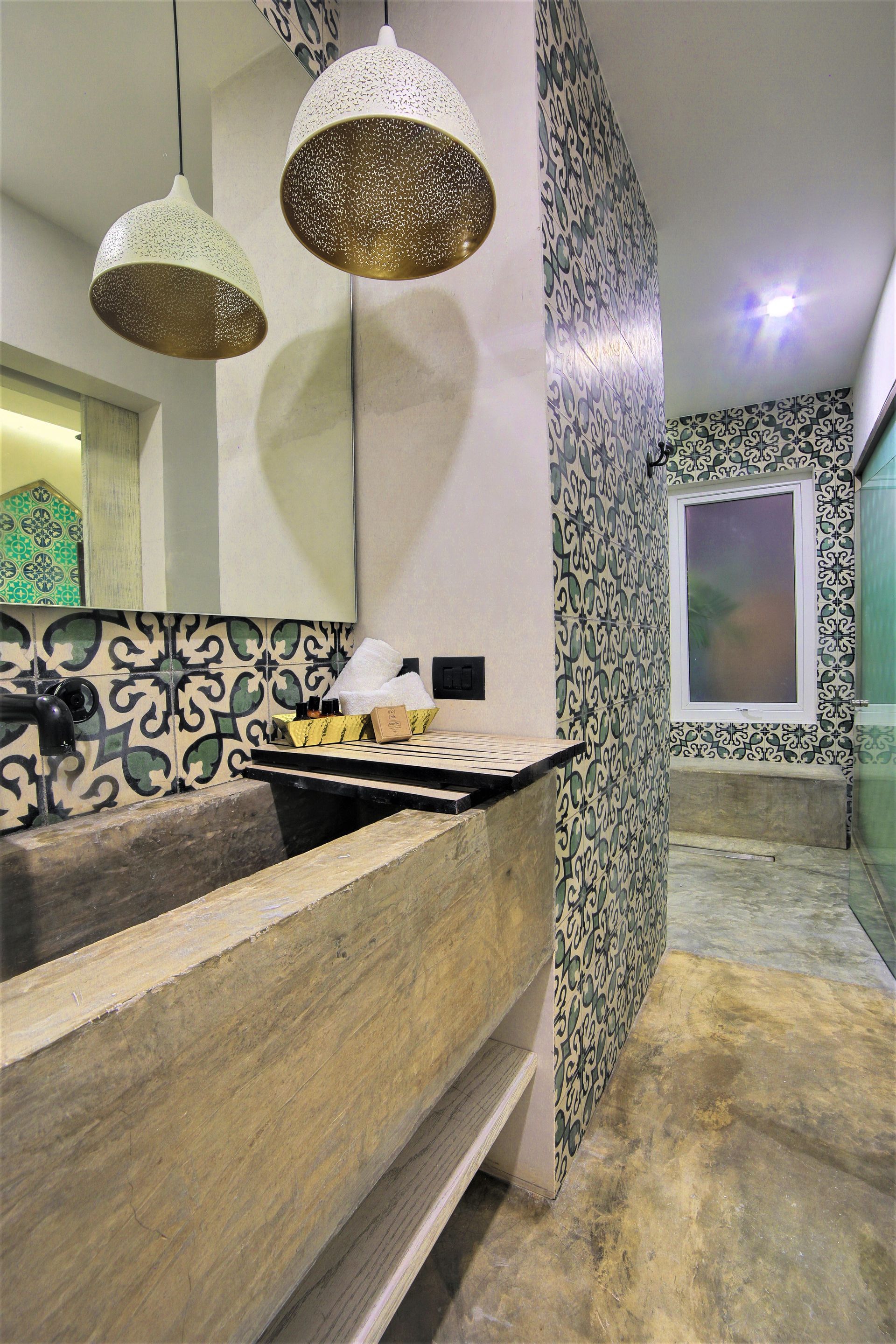 A bathroom with a sink , mirror , and shower.