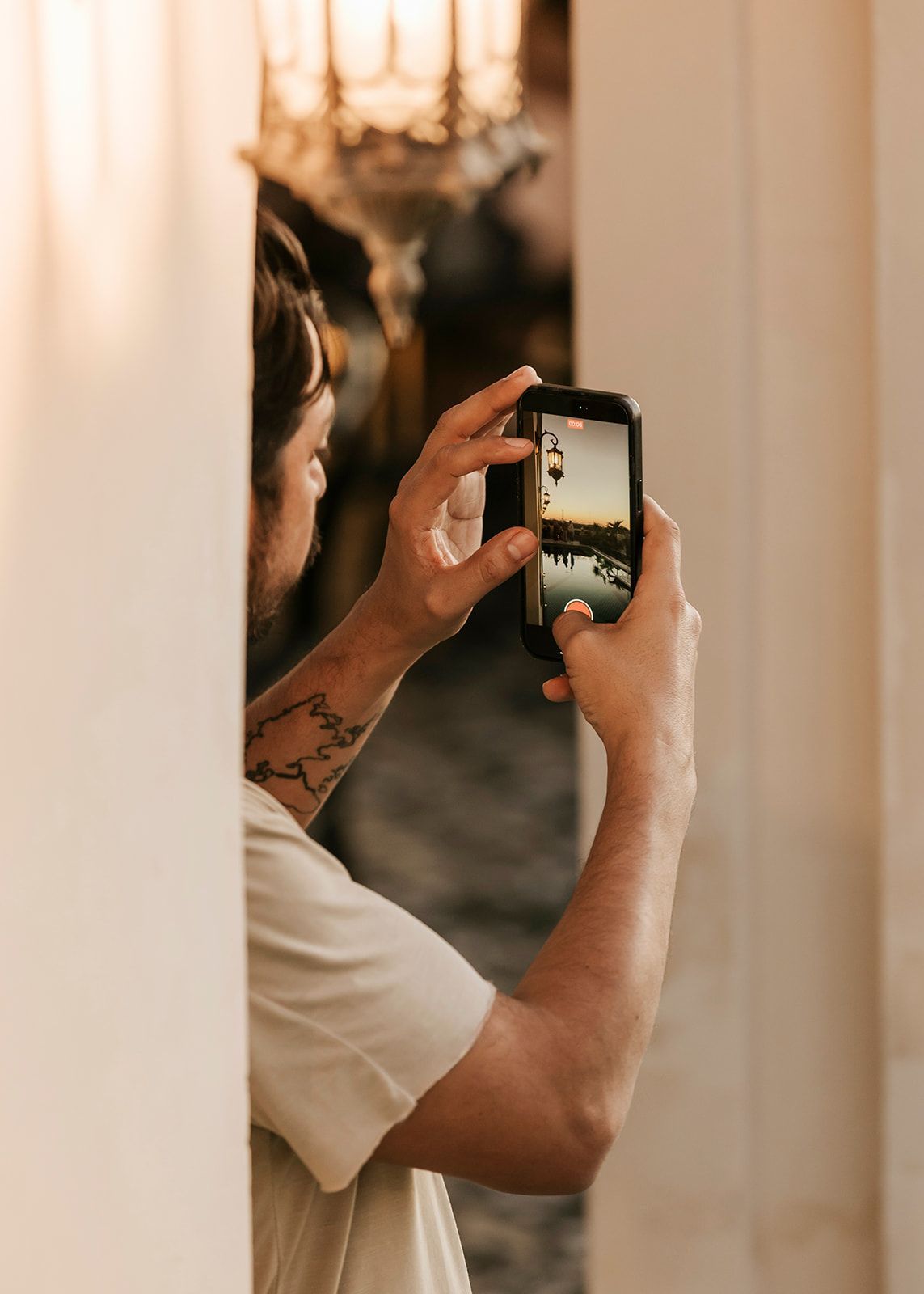 A man is taking a picture of himself with his cell phone.