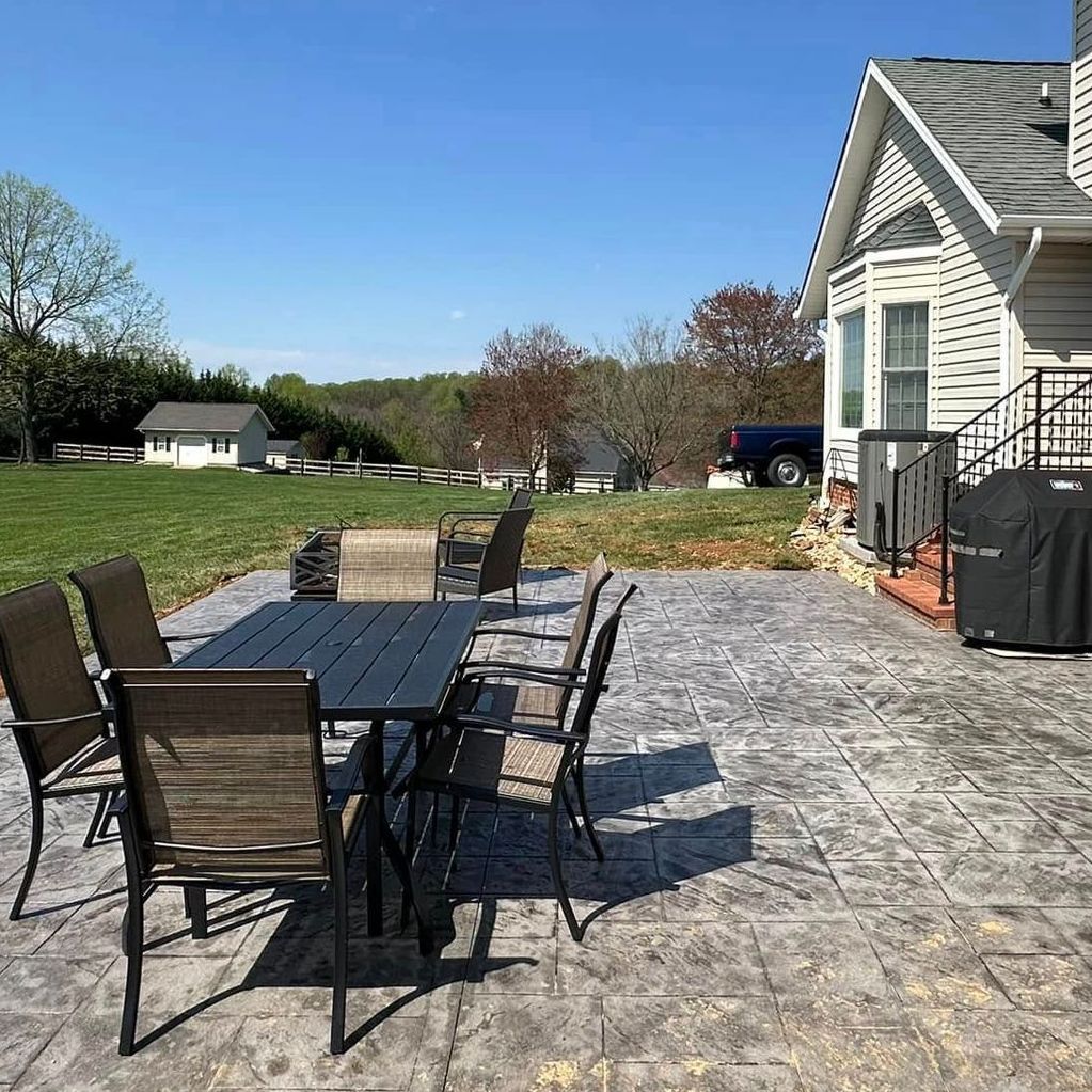 Maryland patio by Xscape 2 Nature with distinct dining and lounging areas designed for versatile outdoor living and entertaining.