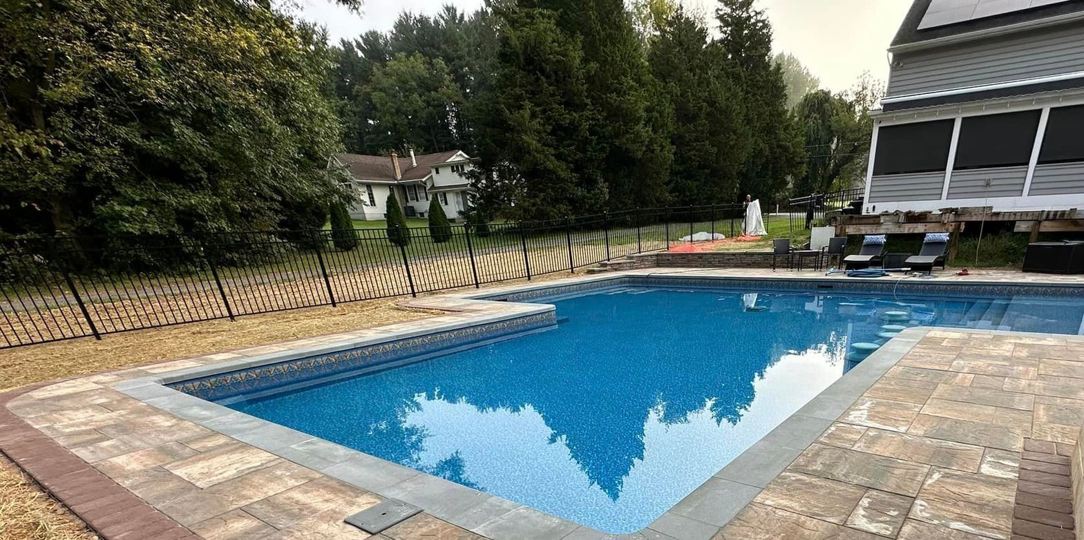 Finished fiberglass pool with custom hardscaping by Xscape 2 Nature in Fallston, MD

