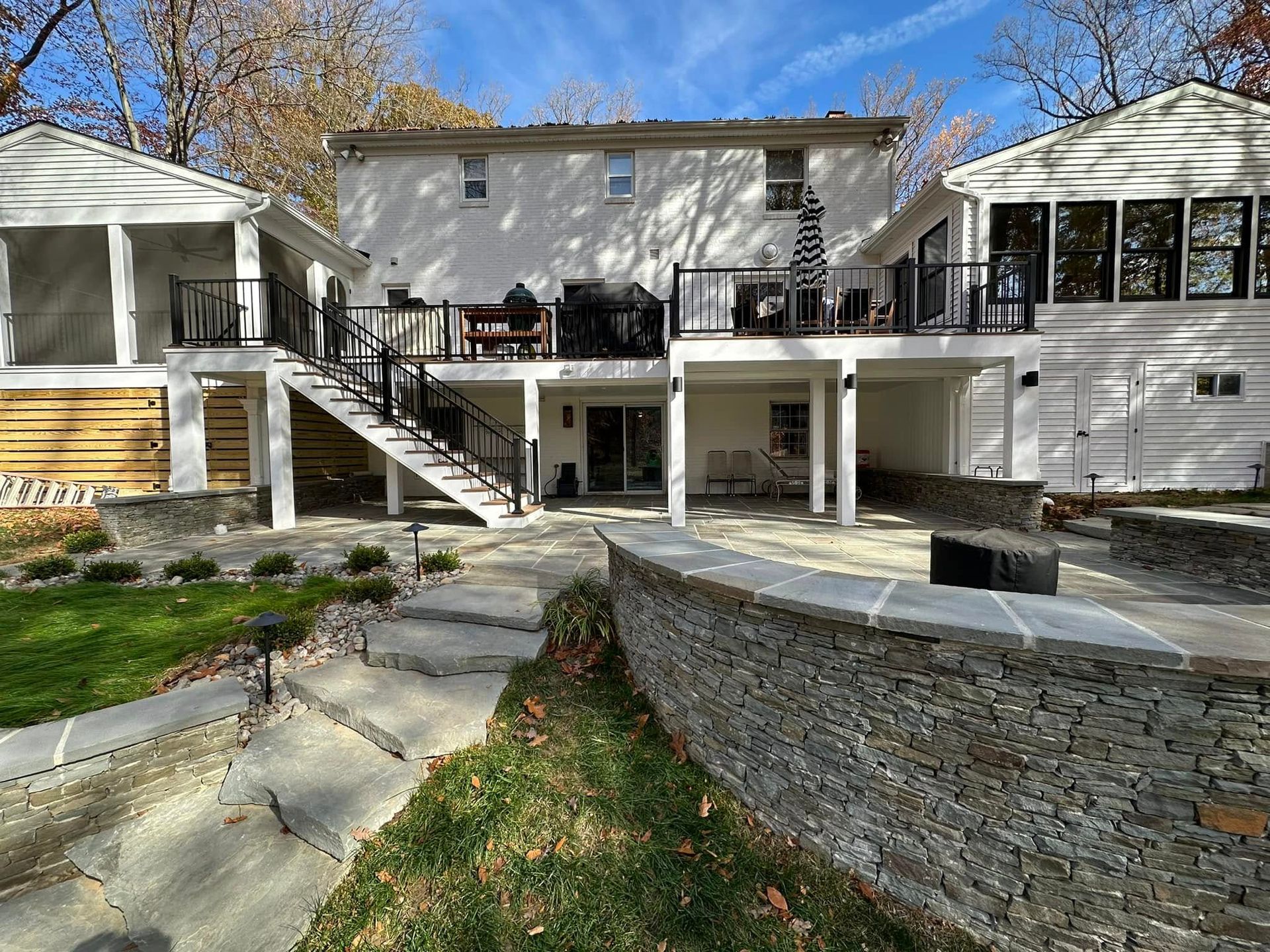 Natural Stone Patio, Retaining Wall, and Fireplace in the backyard of a home in Baltimore County Maryland