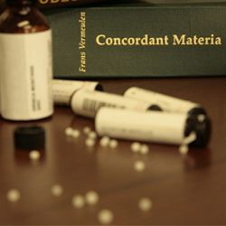 A book called concordant materia sits on a table