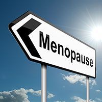 A sign that says `` menopause '' is pointing to the right.