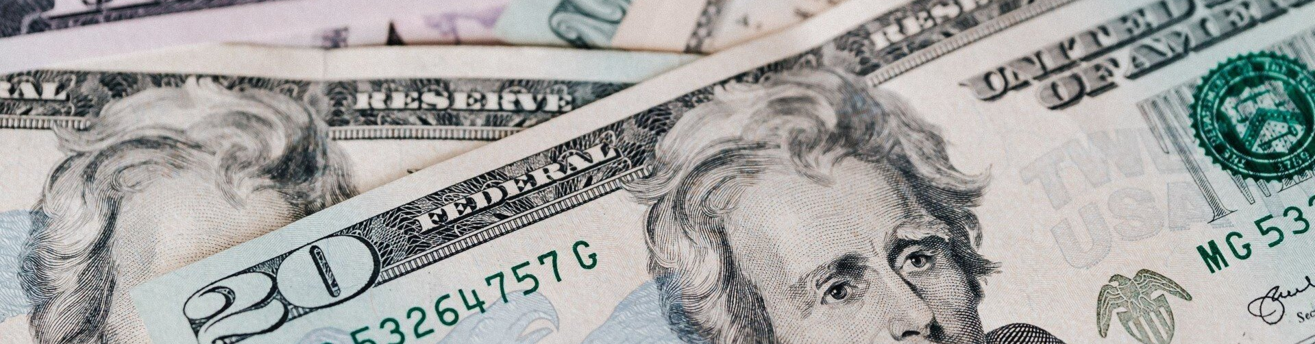 u.s. paper money in a small pile