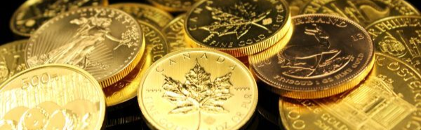 Pile of gold coins from around the world on a black background