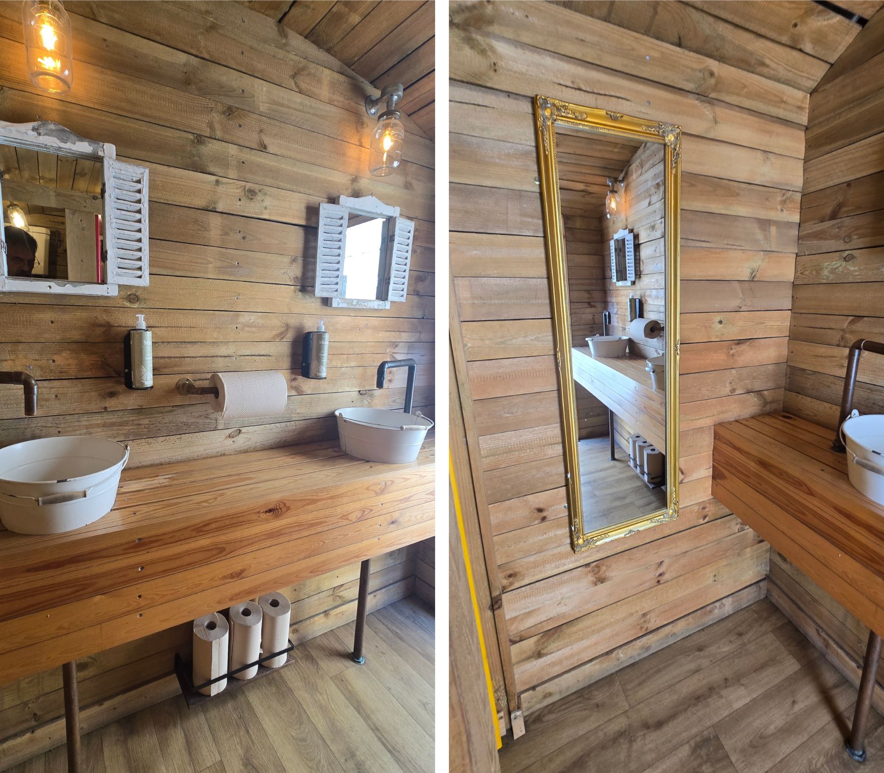 Rustic wooden bathroom with two white vessel sinks, mirrors, and warm wall sconces.