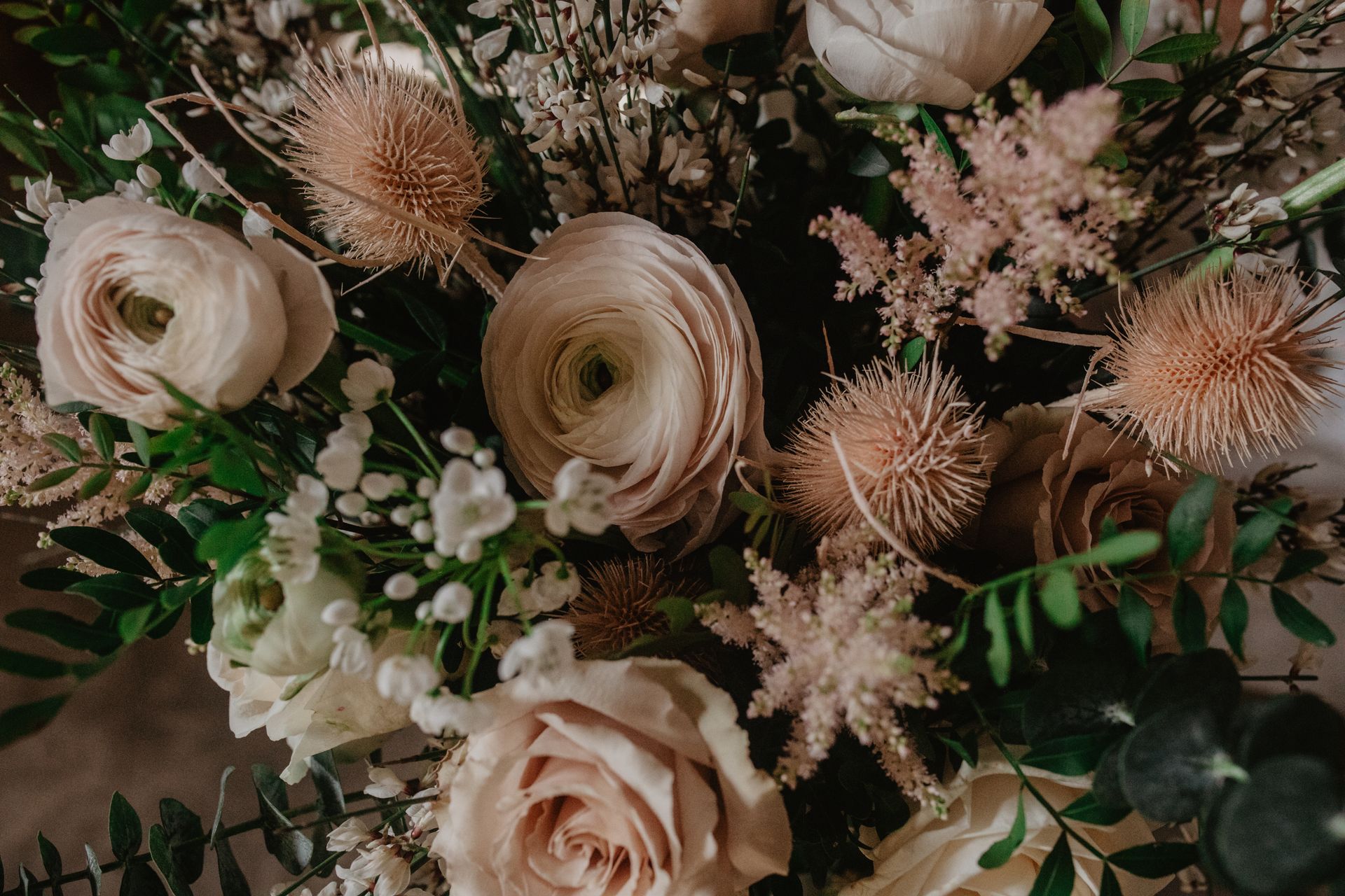 A close up of a bouquet of flowers on a table.