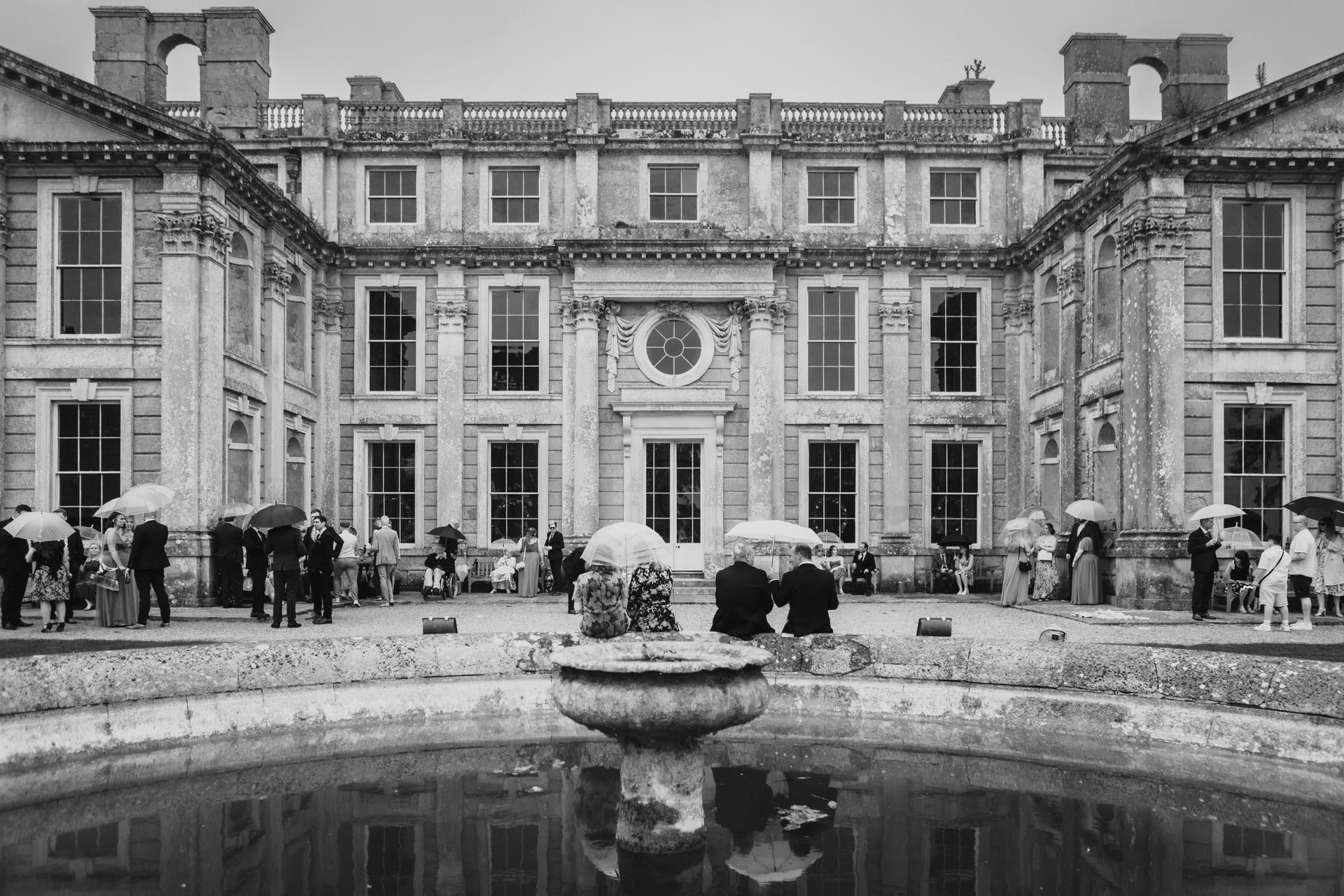 A large building with a fountain in front of it
