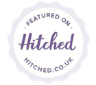 A purple and white badge that says featured on hitched.co.uk