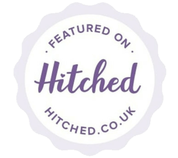 A purple and white badge that says featured on hitched.co.uk