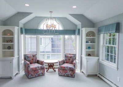 A living room with two chairs and a table