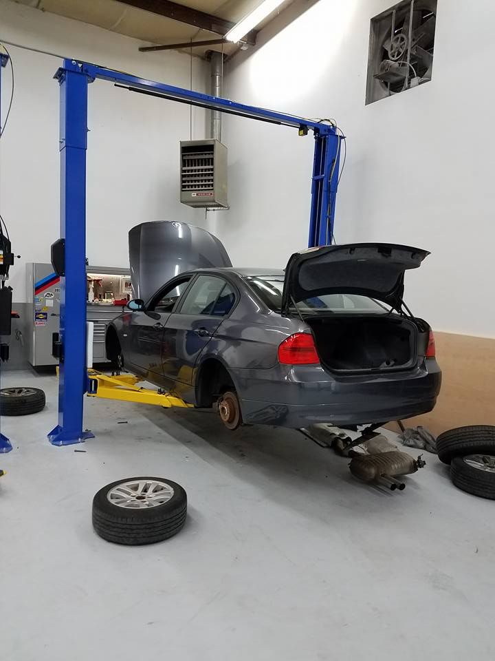 Vehicle Service Inside Auto Repair Bay | Premier Autowerks