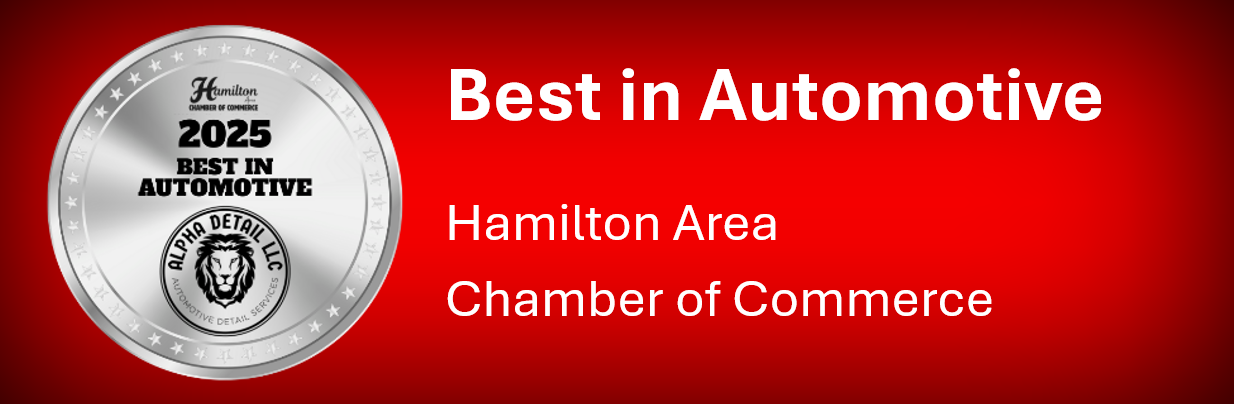 A silver coin that says best in automotive hamilton area chamber of commerce