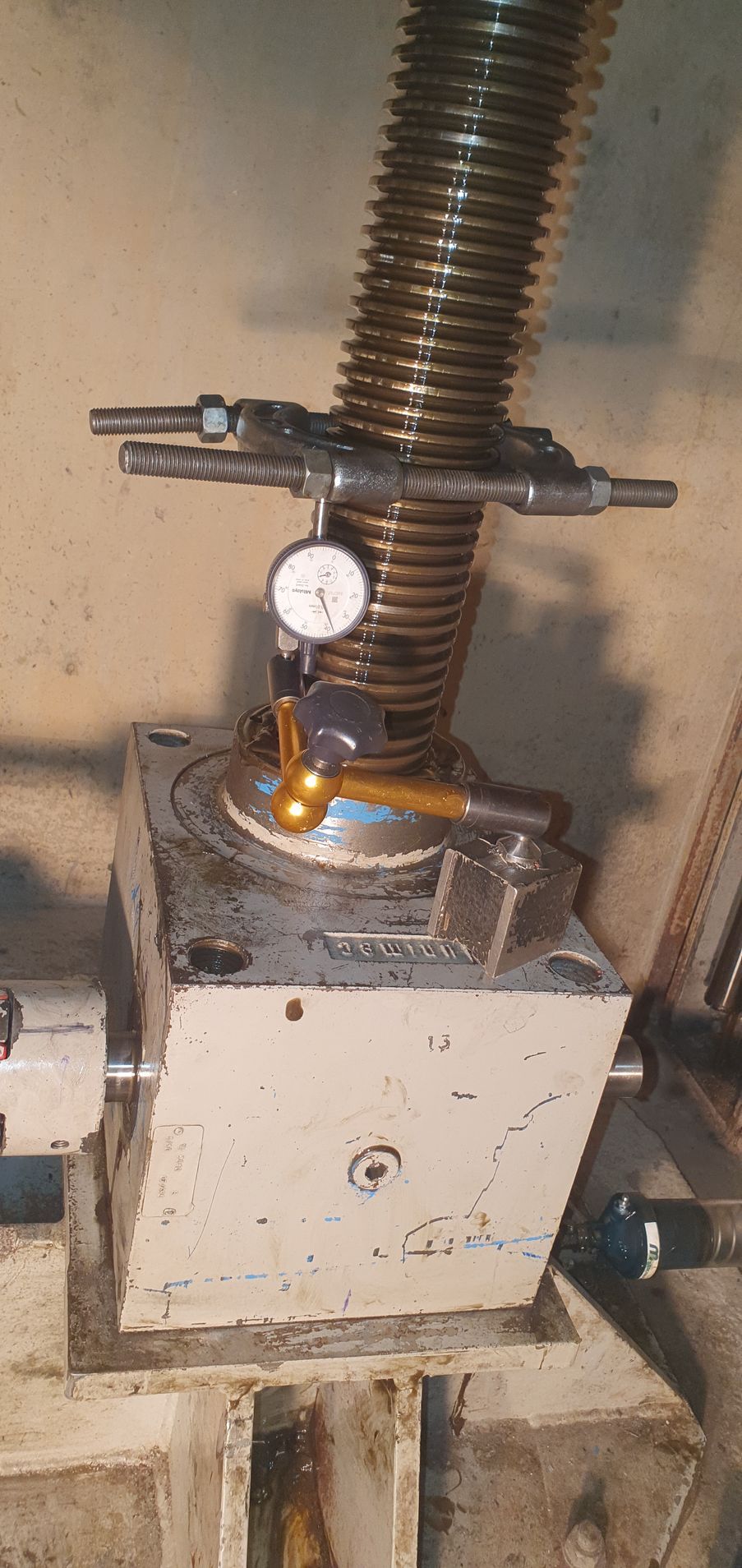 A close up of a machine with a gauge on top of it.