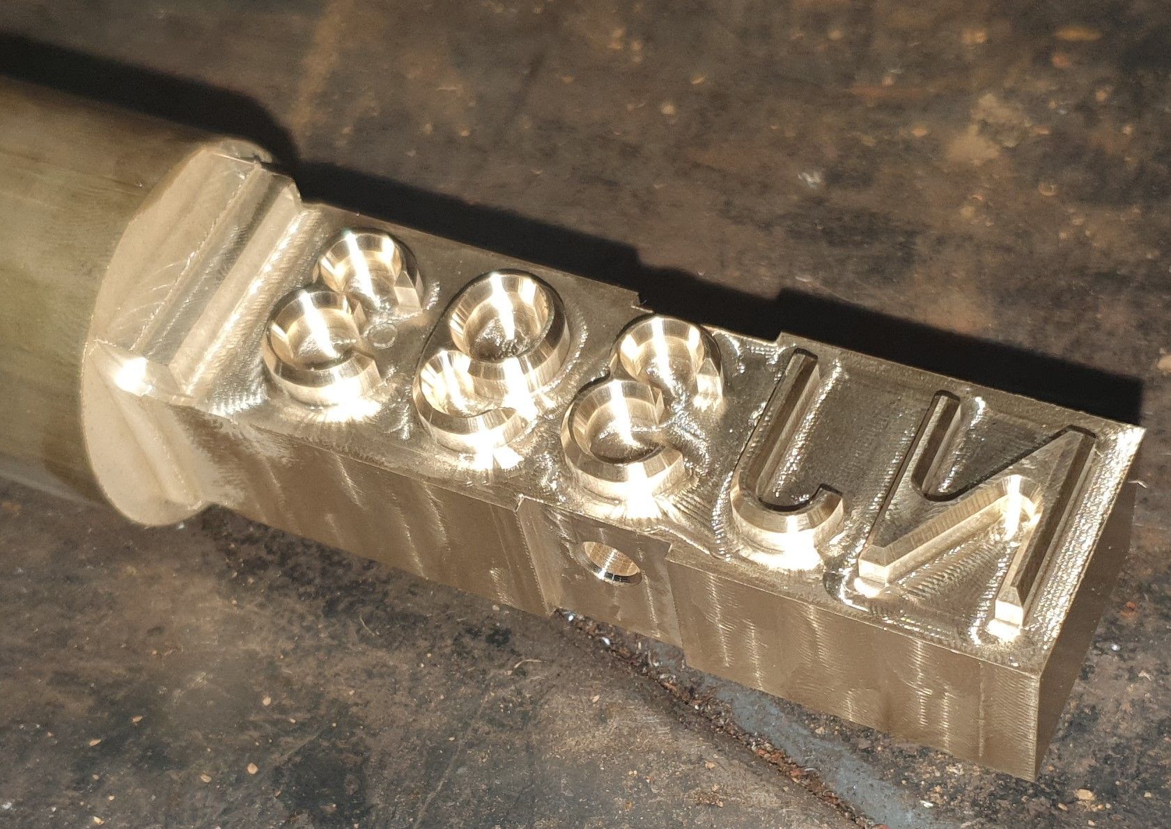 A close up of a piece of metal that says lm