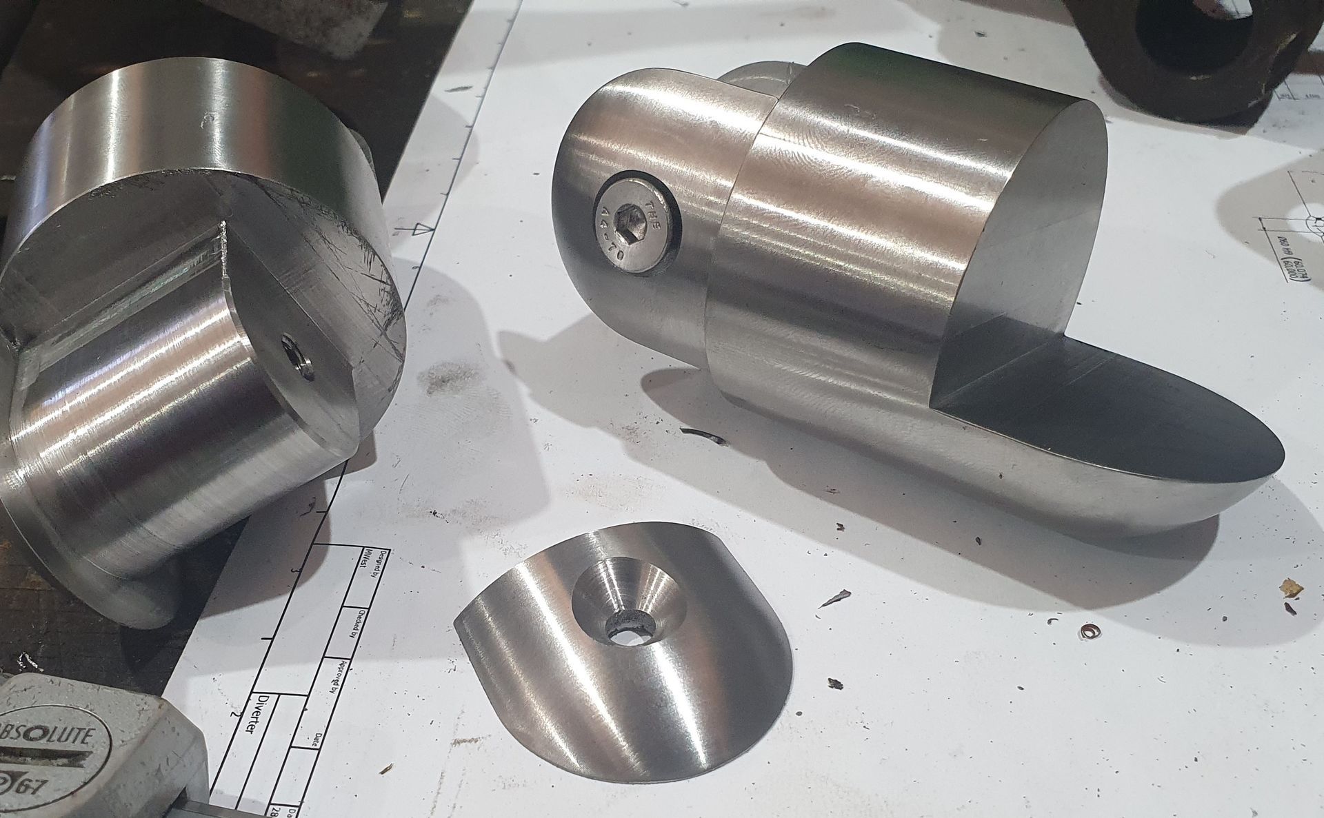 A bunch of metal pieces are sitting on a table.