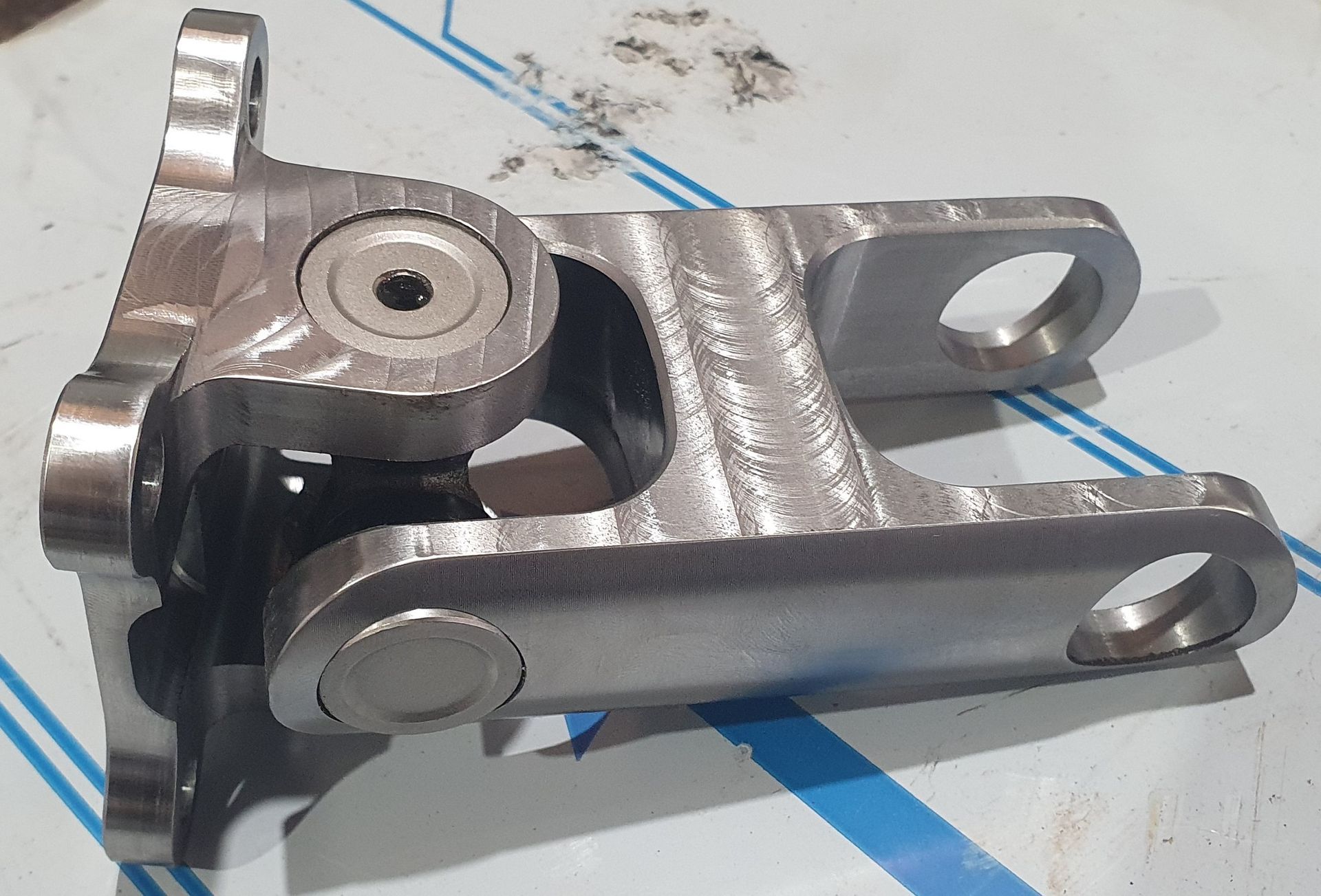 A piece of metal is sitting on a piece of stainless steel