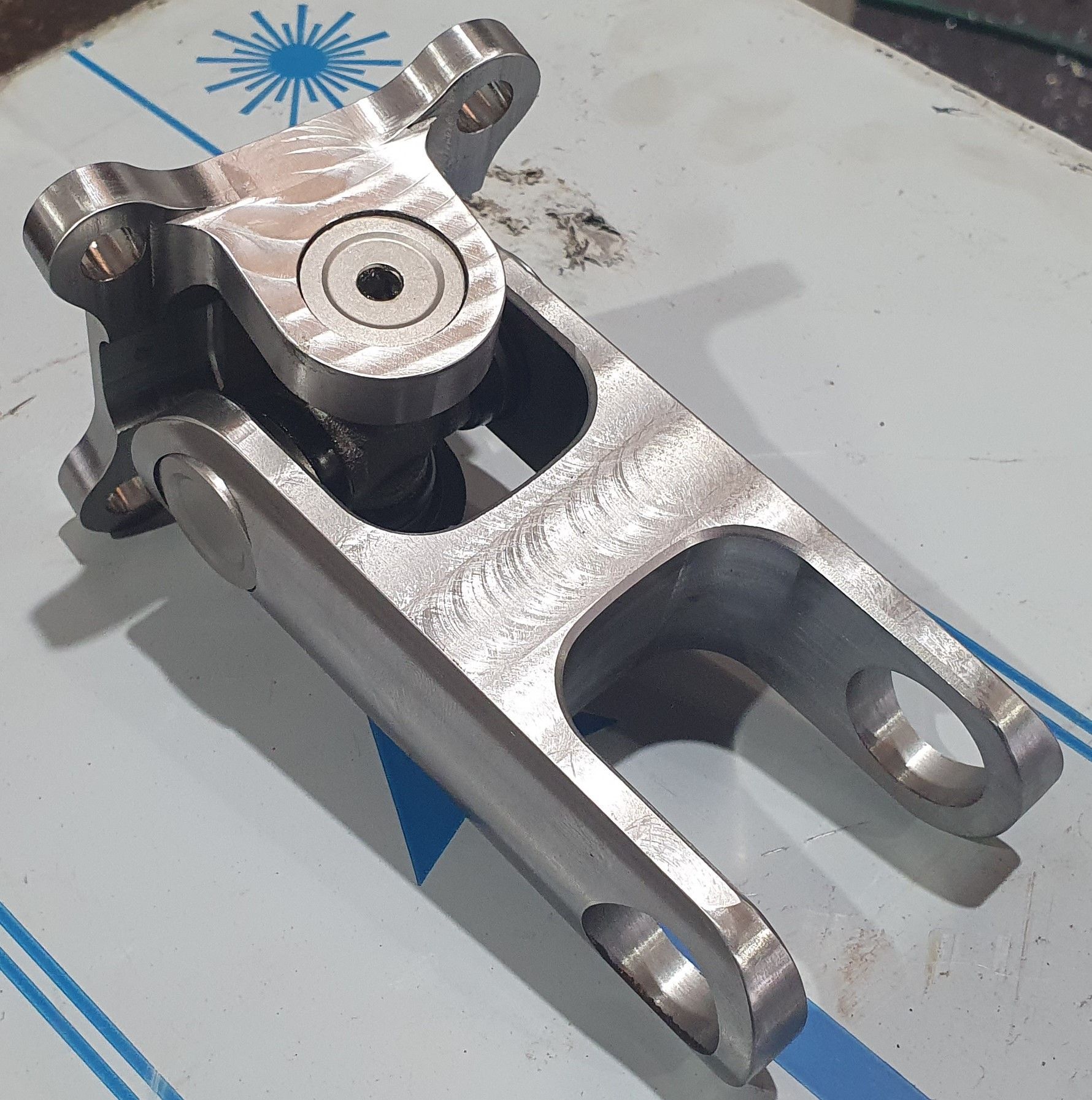A stainless steel joint with a hole in the middle