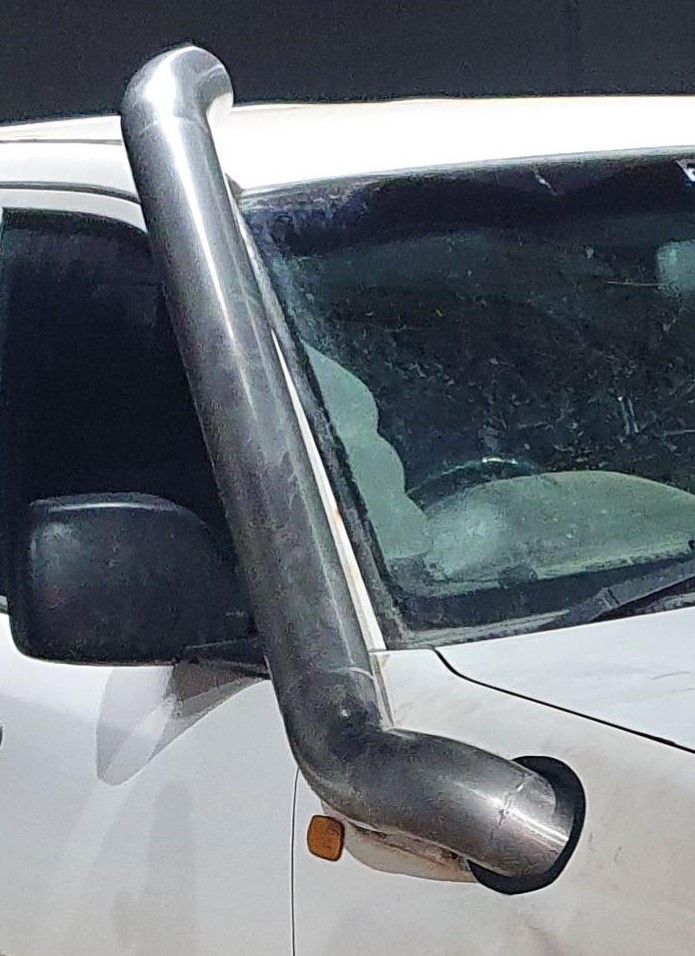 A white car with a snorkel on the side of it.