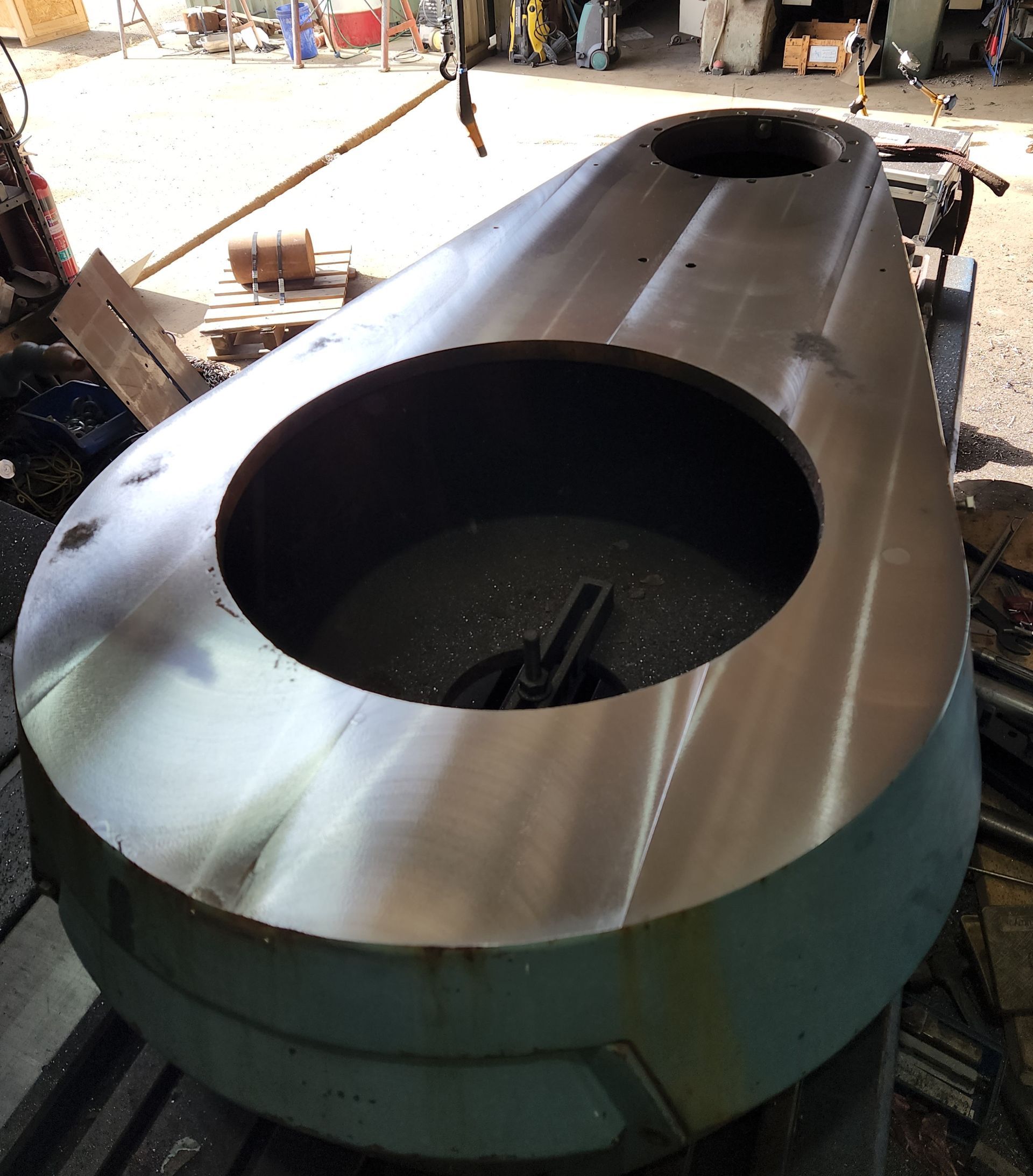 A large piece of metal with a hole in the middle