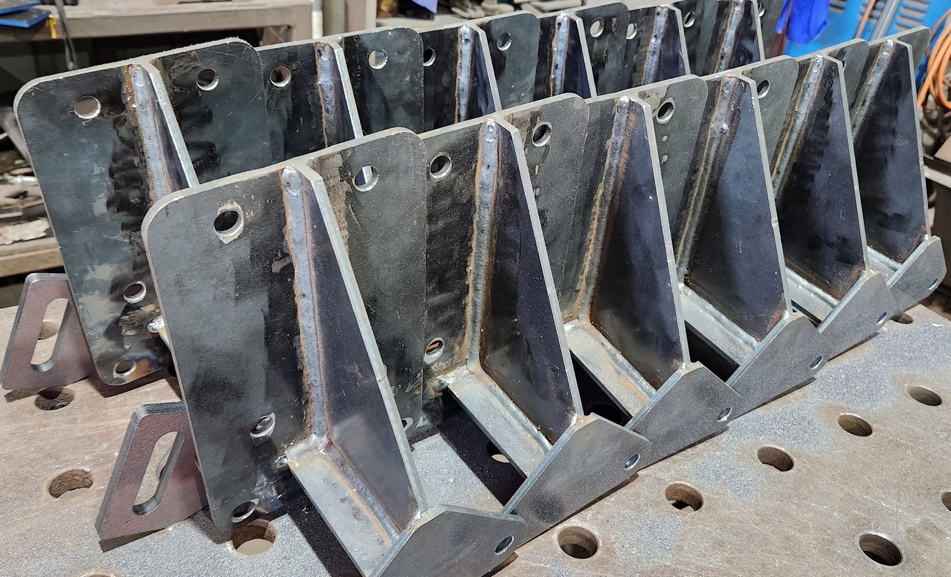 A bunch of metal pieces are sitting on top of each other on a table.