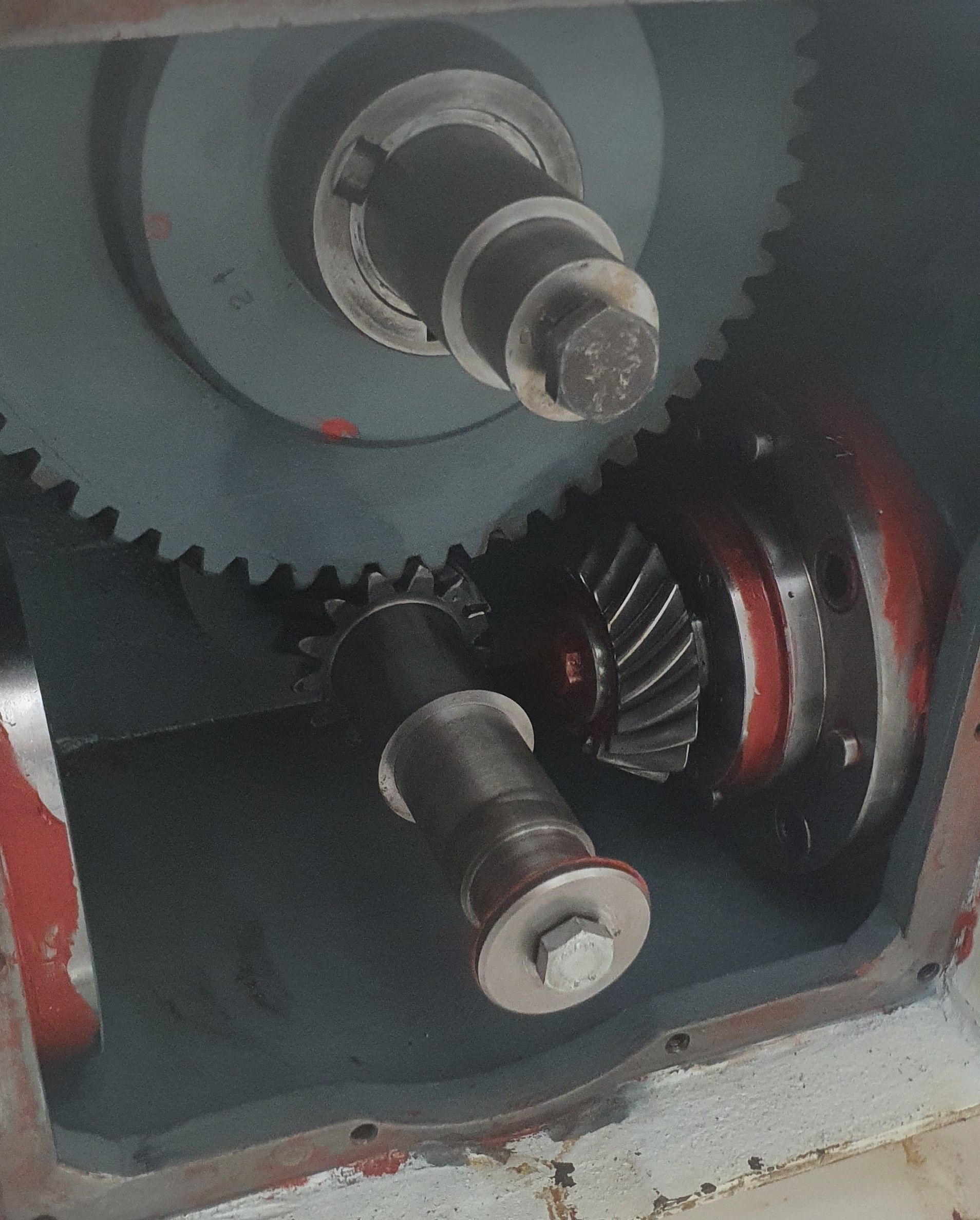 A close up of a gearbox with a screw in it