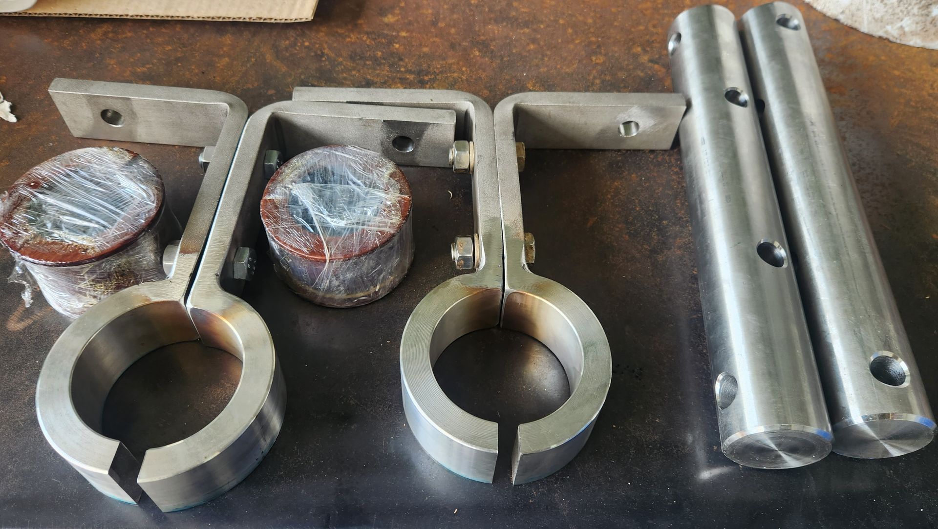 A bunch of metal parts are sitting on a table