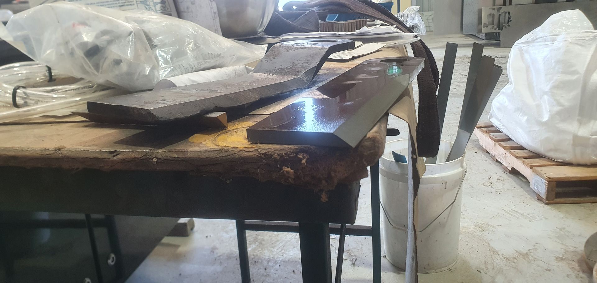 A wooden table with a few pieces of wood on it