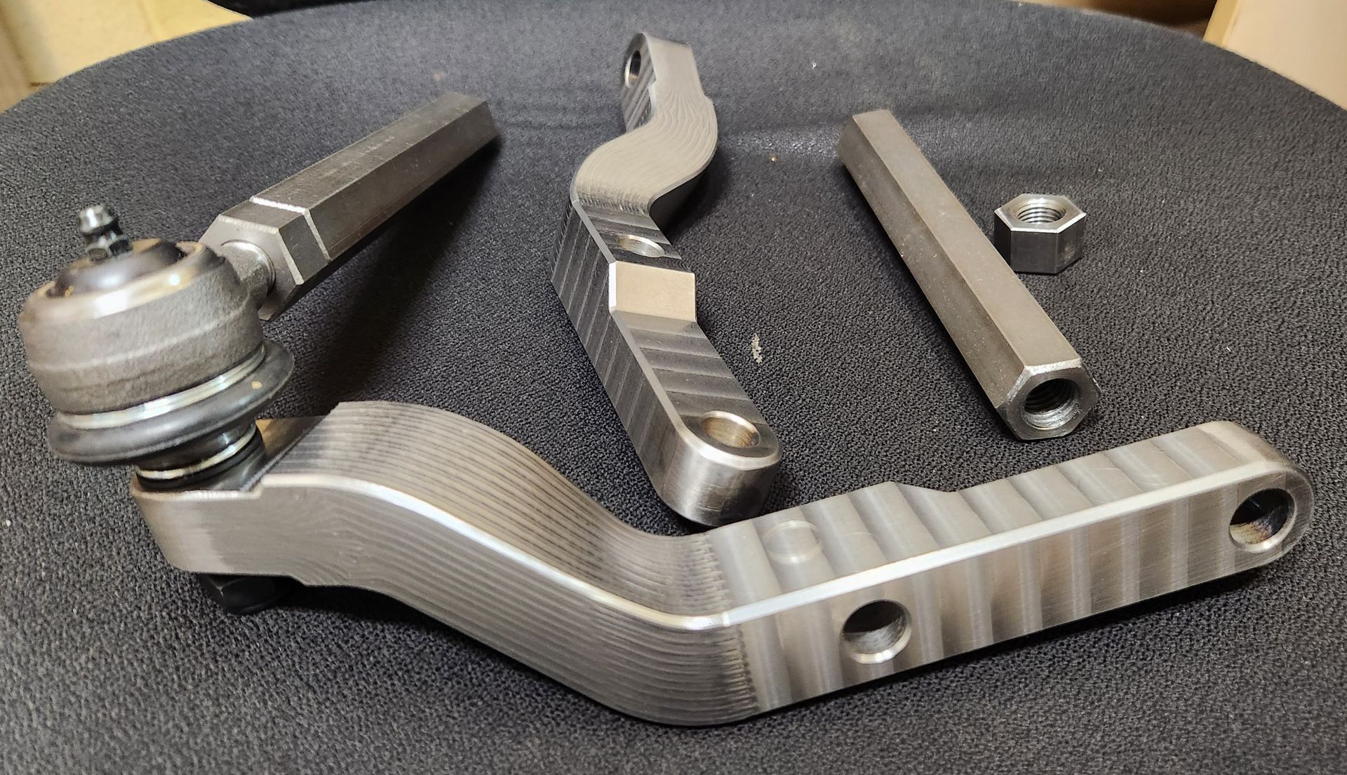 A bunch of metal parts are sitting on a table