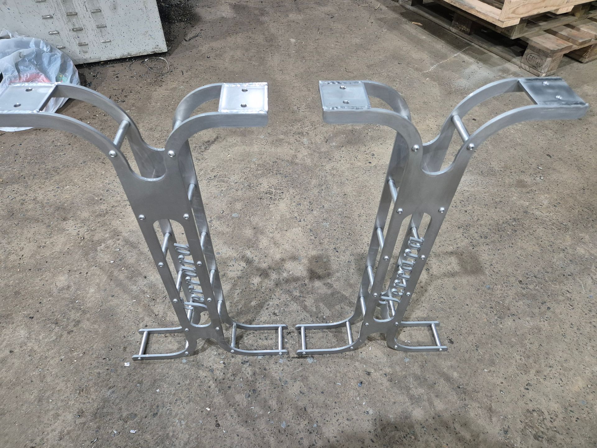 A metal structure is sitting on a concrete surface