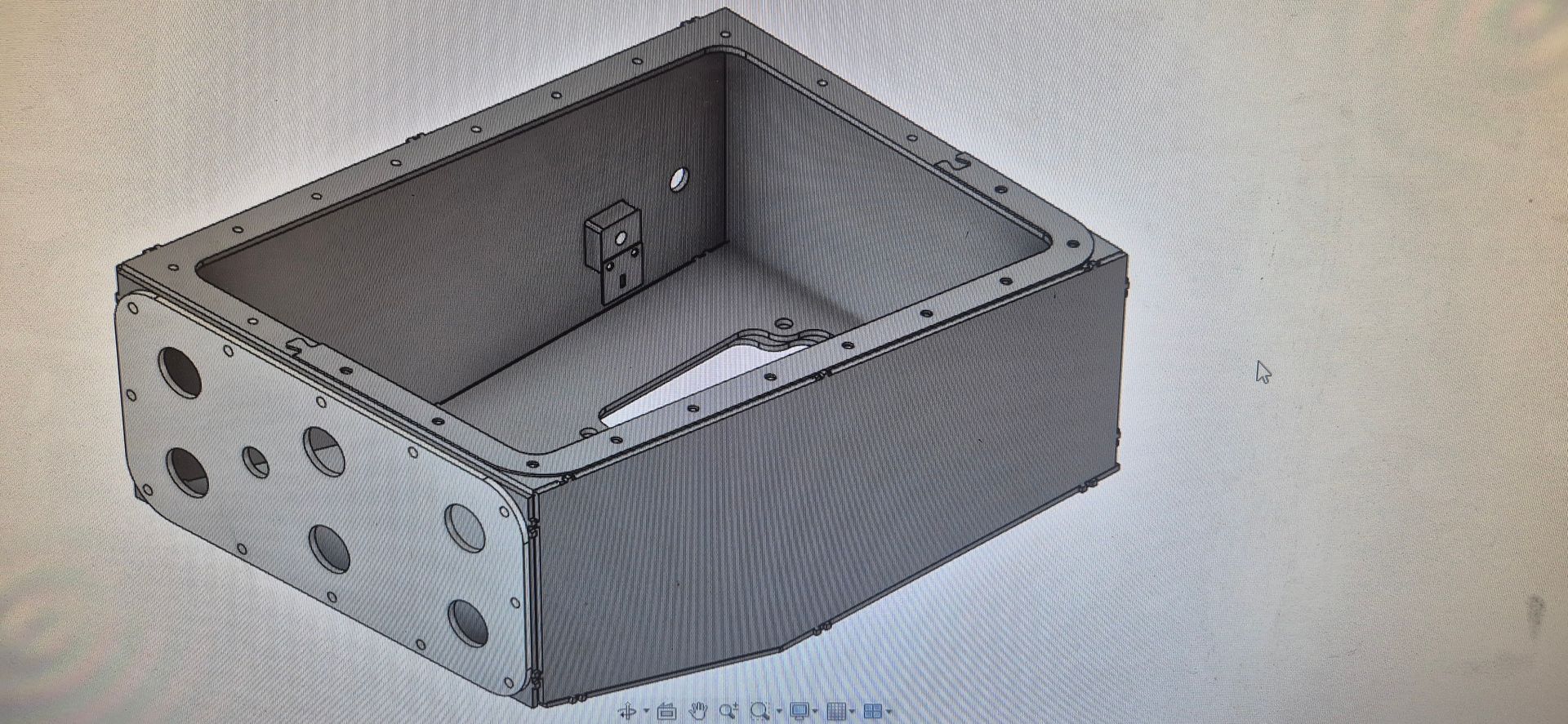 A black and white drawing of a metal box with holes in it