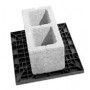 A black and white photo of a concrete block on a black tray.