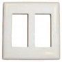 A white switch plate with two holes in it on a white background.
