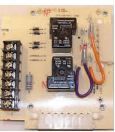 A picture of a thermostat board with a purple hose attached to it.